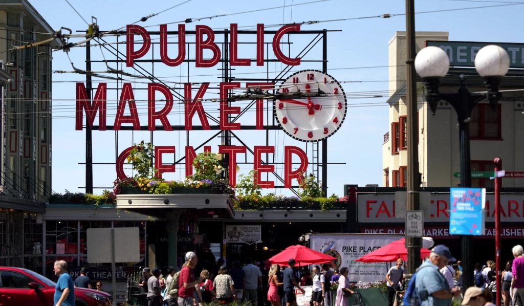 Pike Place Market Sign Above Crowd of People